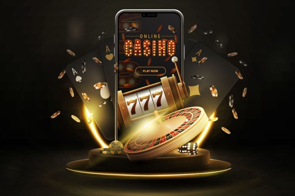ilustratie cu un telefon mobil, alaturi de jetoane, un tambur de slot, carti de joc si o ruleta de cazino in culori negru-aurii