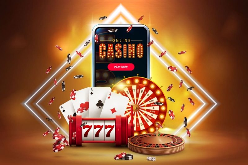 telefon mobil pe care ruleaza o aplicatie de cazino online, cu jetoane, ruleta, zaruri, carti de joc si un slot mecanic in jur