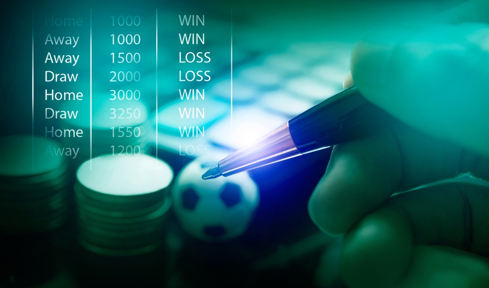 o persoană care analizează un meci de fotbal